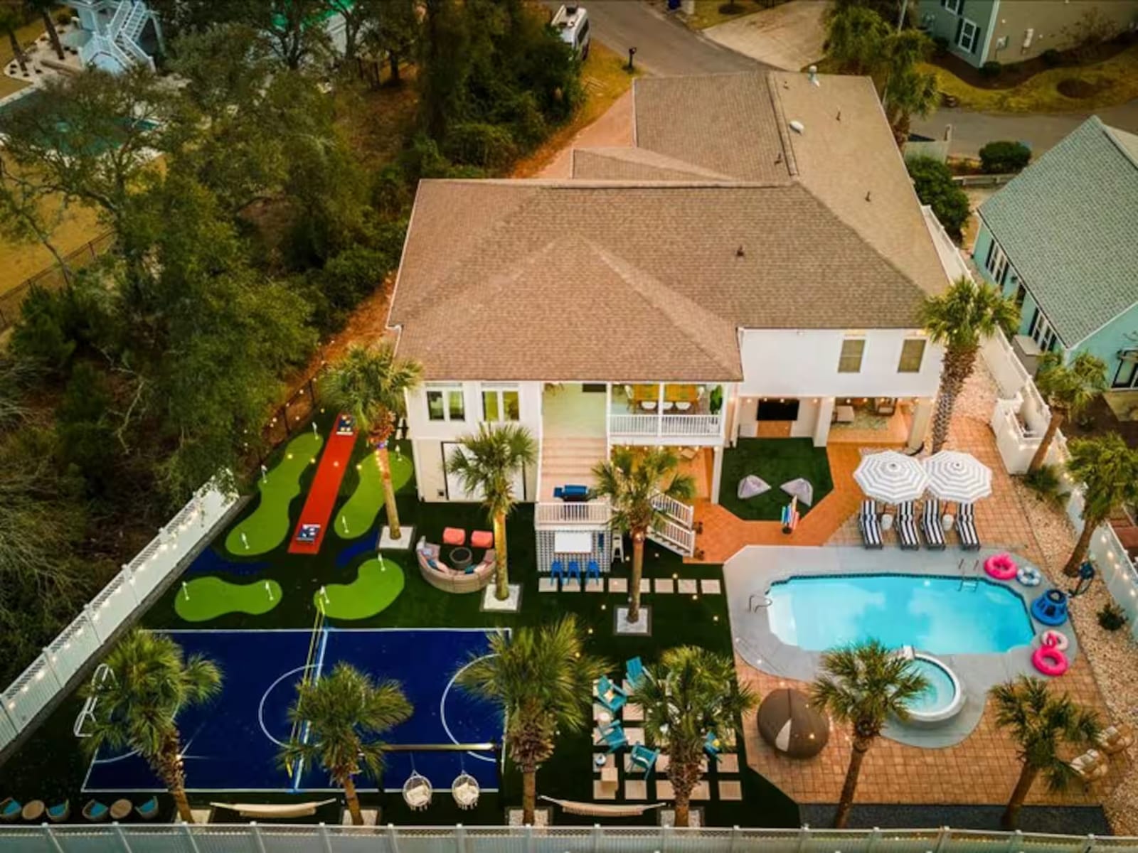 Aerial view of the JimPhiLympics arena — pool, hot tub, mini-golf, and a sport court